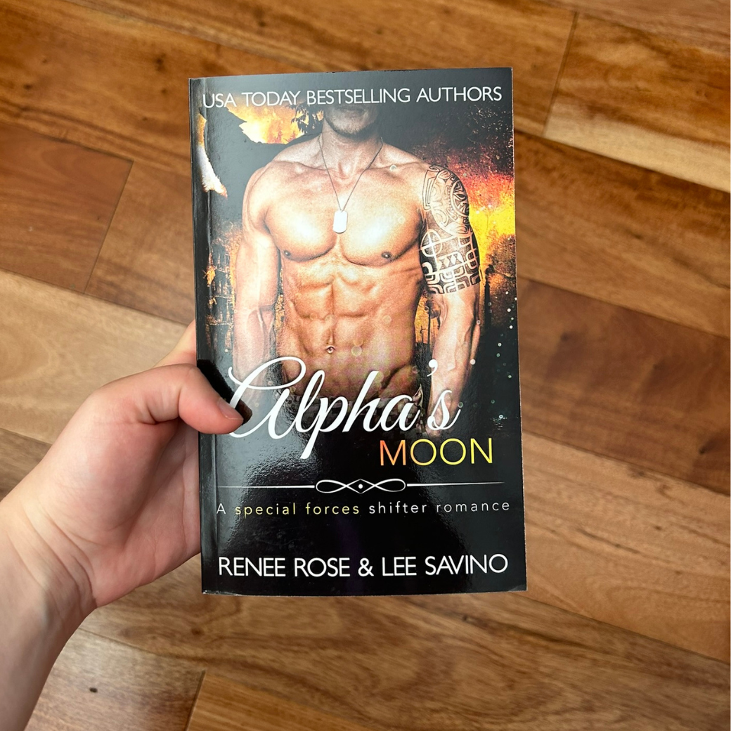 Photo of someone holding an Alphas Moon paperback