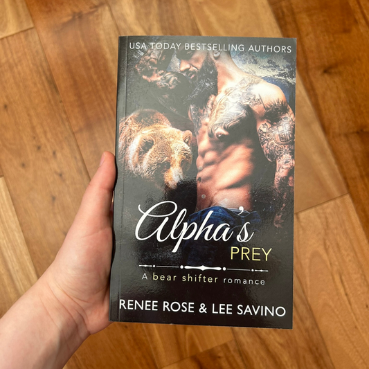 Photo of someone holding a classic Alphas Prey cover paperback