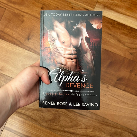 Photo of someone holding a classic Alphas Revenge cover paperback