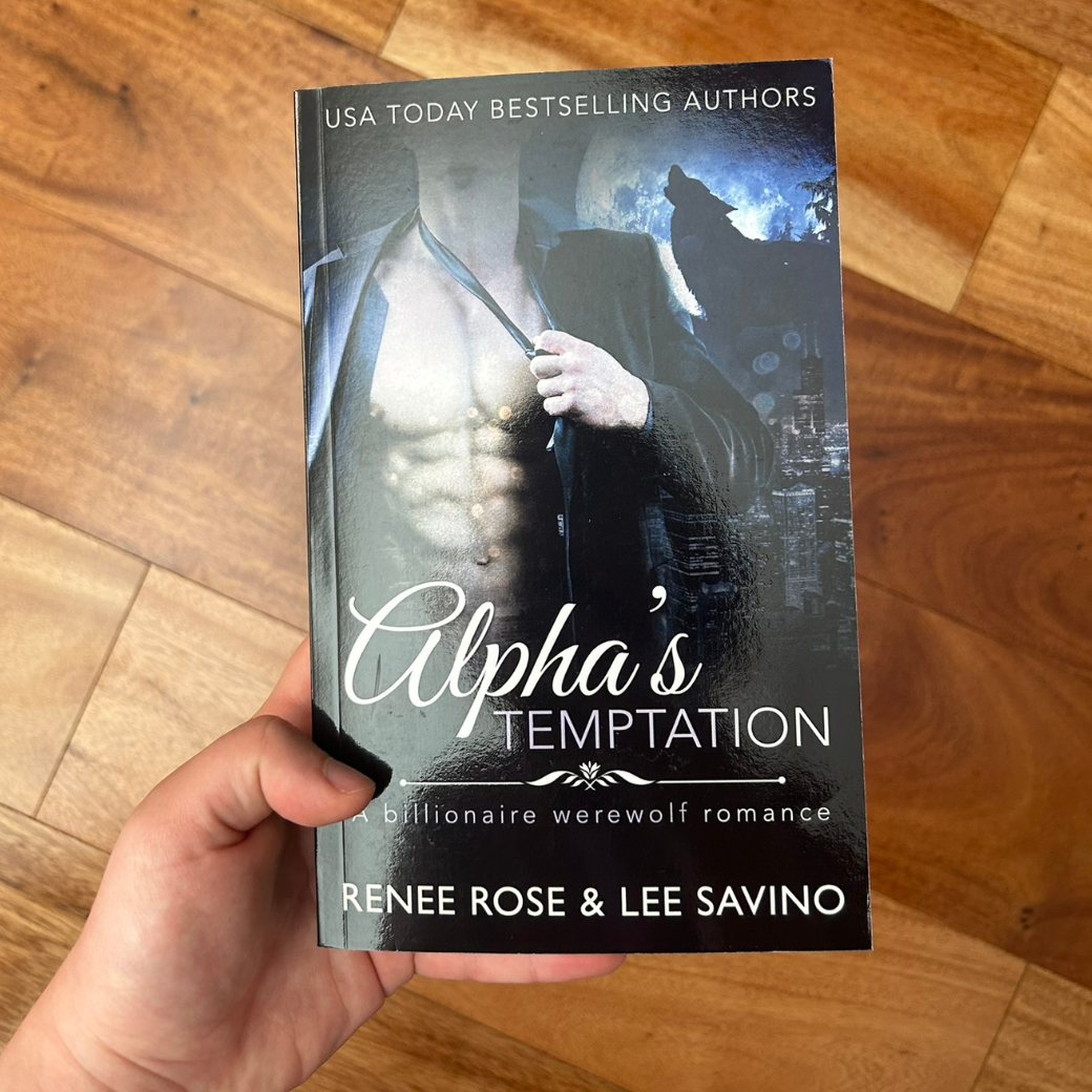 Photo of someone holding a classic Alphas Temptation cover paperback