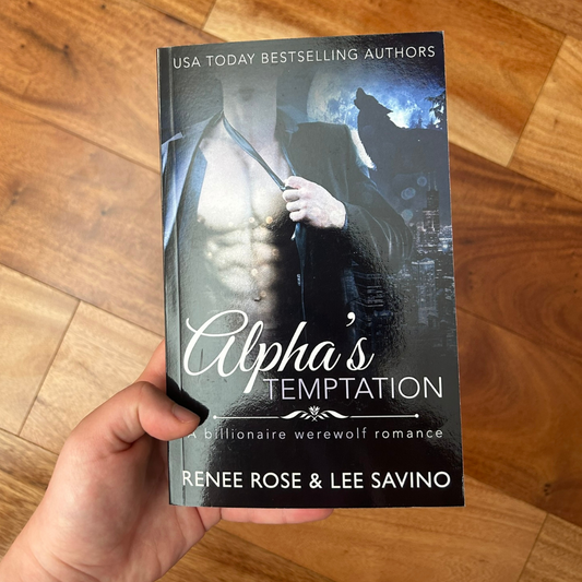 Photo of someone holding a classic Alphas Temptation cover paperback