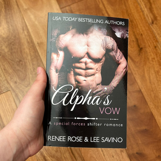 Photo of someone holding an Alphas Vow paperback