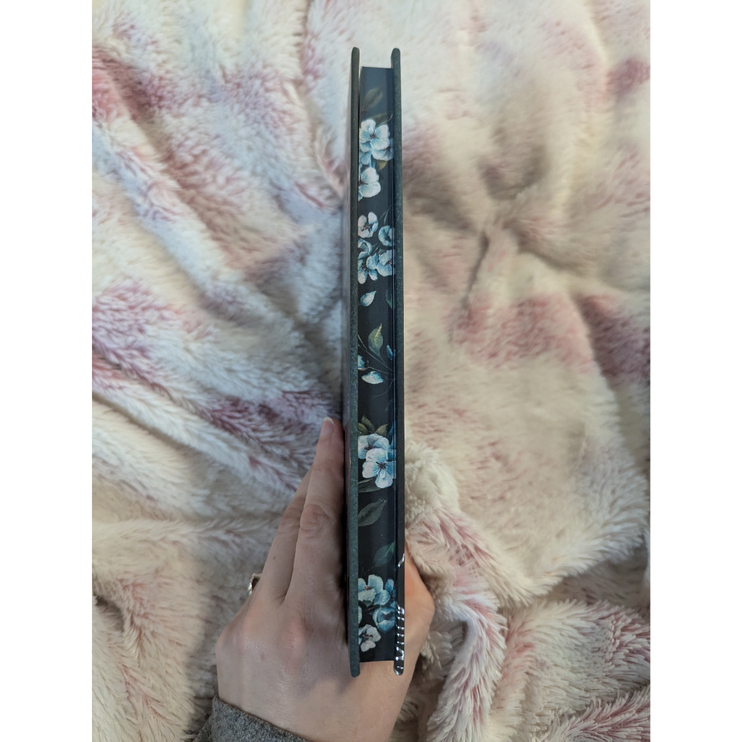 edge of book with blue flowers