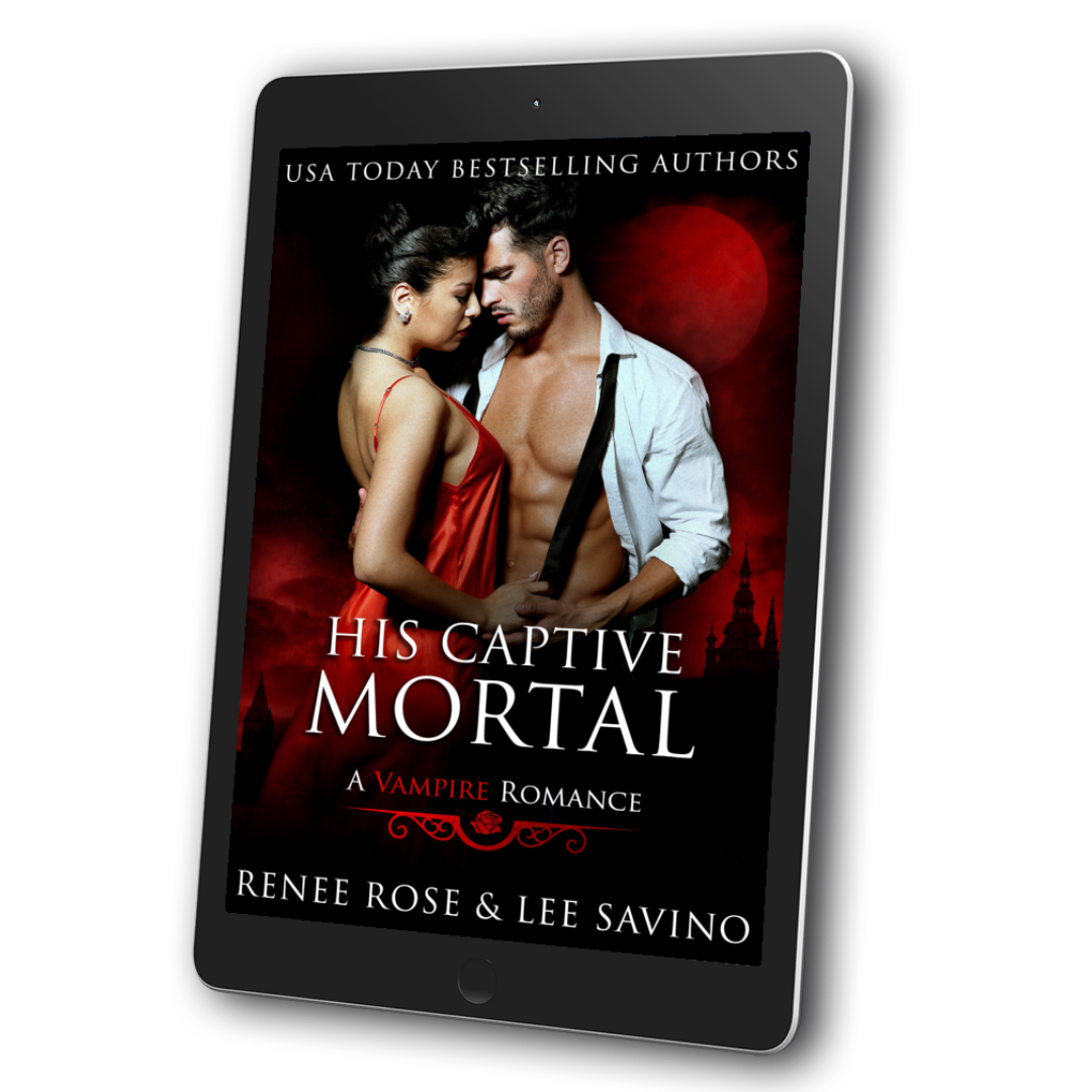 Image of an ebook. The cover's background is a red sky, full moon, and castle in the background. It features a black-haired women in a red dress holding a buff black-haired man who is wearing an unbuttoned white shirt and black tie. In white and red text is the title "His Captive Mortal A Vampire Romance." On the top of the cover in white text is "USA Today Bestselling Authors." On the bottom in white text is "Renee Rose & Lee Savino"